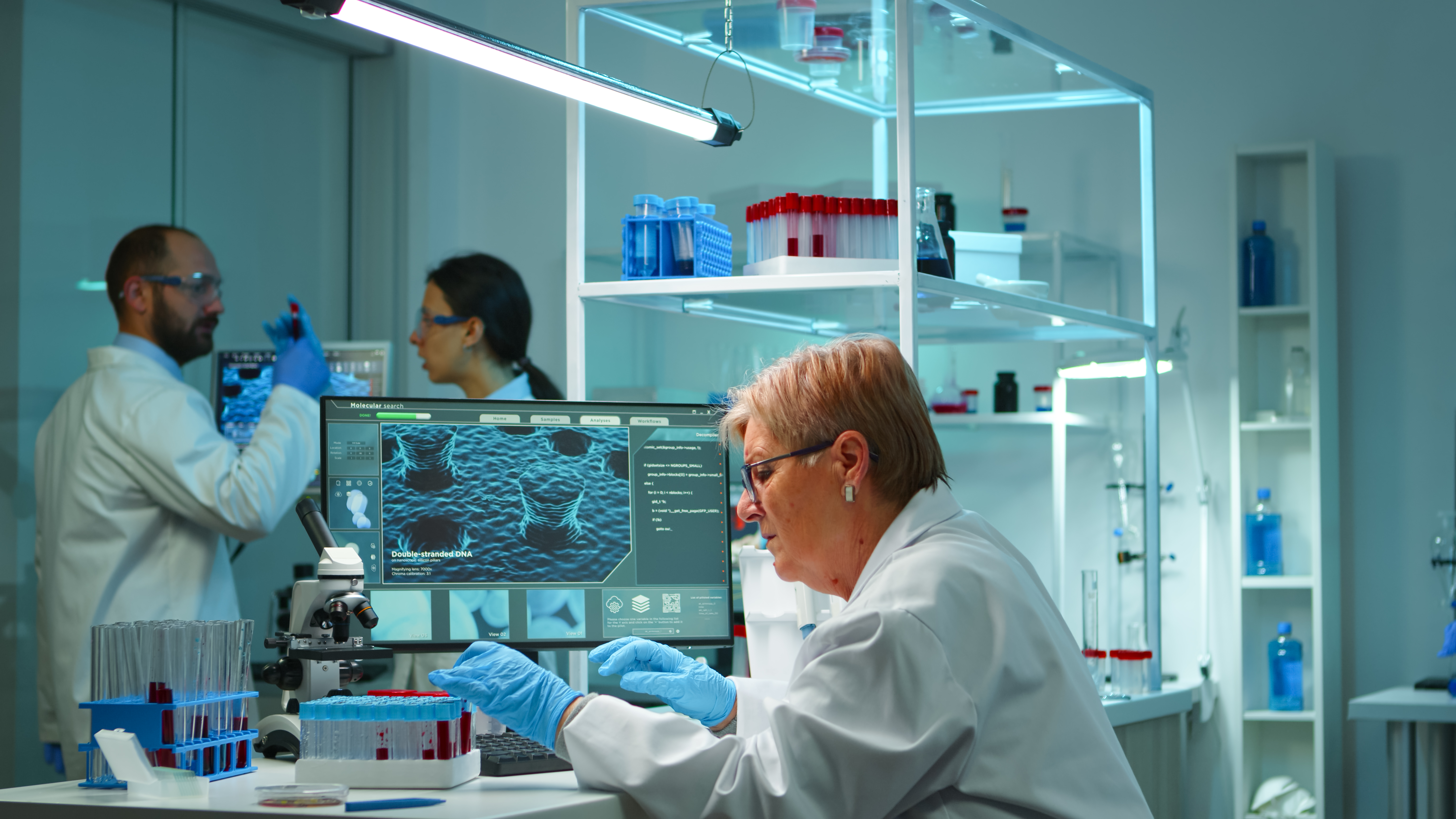 microchemist-doing-research-night-checking-blood-liquid-test-tube-typing-results-pc-modern-equipped-lab-examining-virus-evolution-using-high-tech-vaccine-development-against-covid19